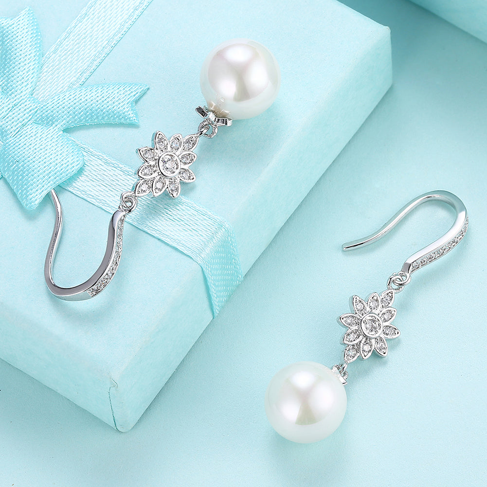 Elegant Freshwater Pearl Starburst Drop Earrings in 18K white gold plating, showcasing a stunning design with hypoallergenic features.