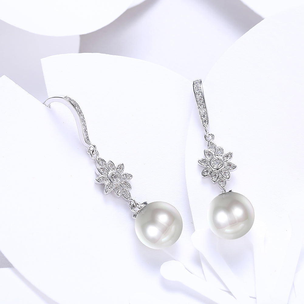 Elegant Freshwater Pearl Starburst Drop Earrings in 18K white gold plating, showcasing a stunning design with hypoallergenic features.