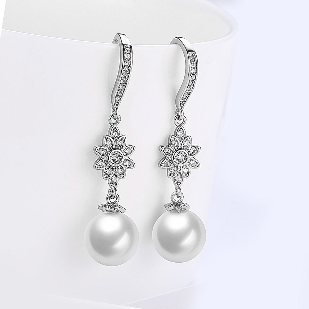 Elegant Freshwater Pearl Starburst Drop Earrings in 18K white gold plating, showcasing a stunning design with hypoallergenic features.