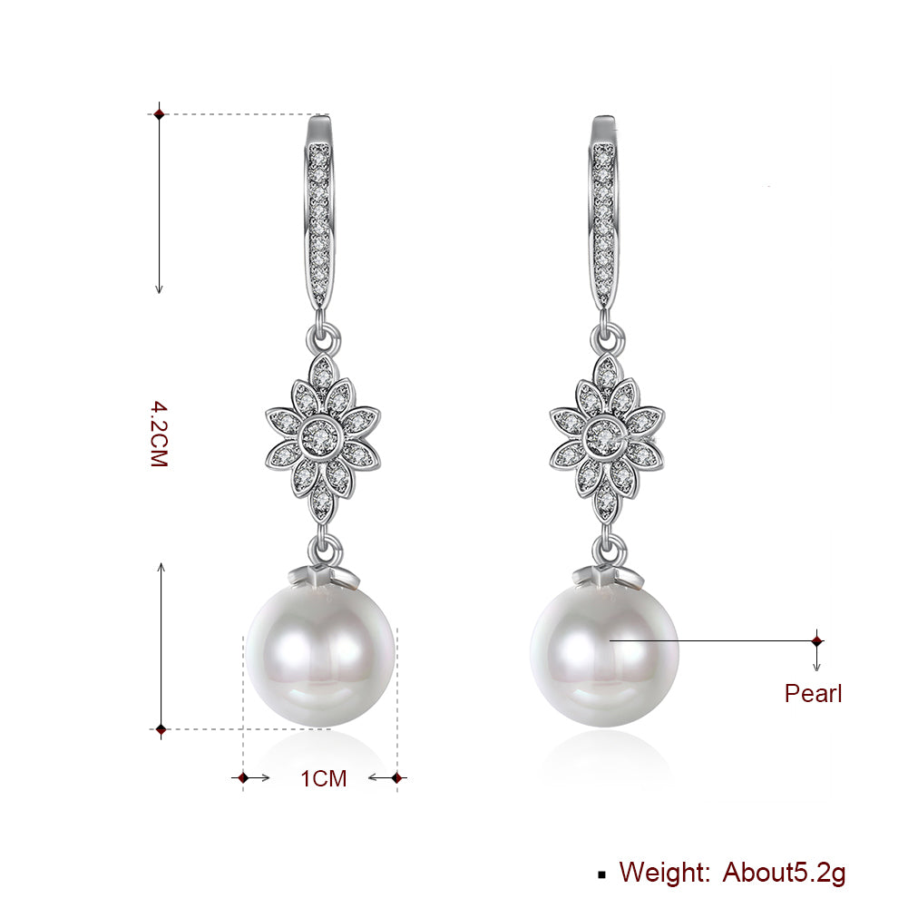 Elegant Freshwater Pearl Starburst Drop Earrings in 18K white gold plating, showcasing a stunning design with hypoallergenic features.