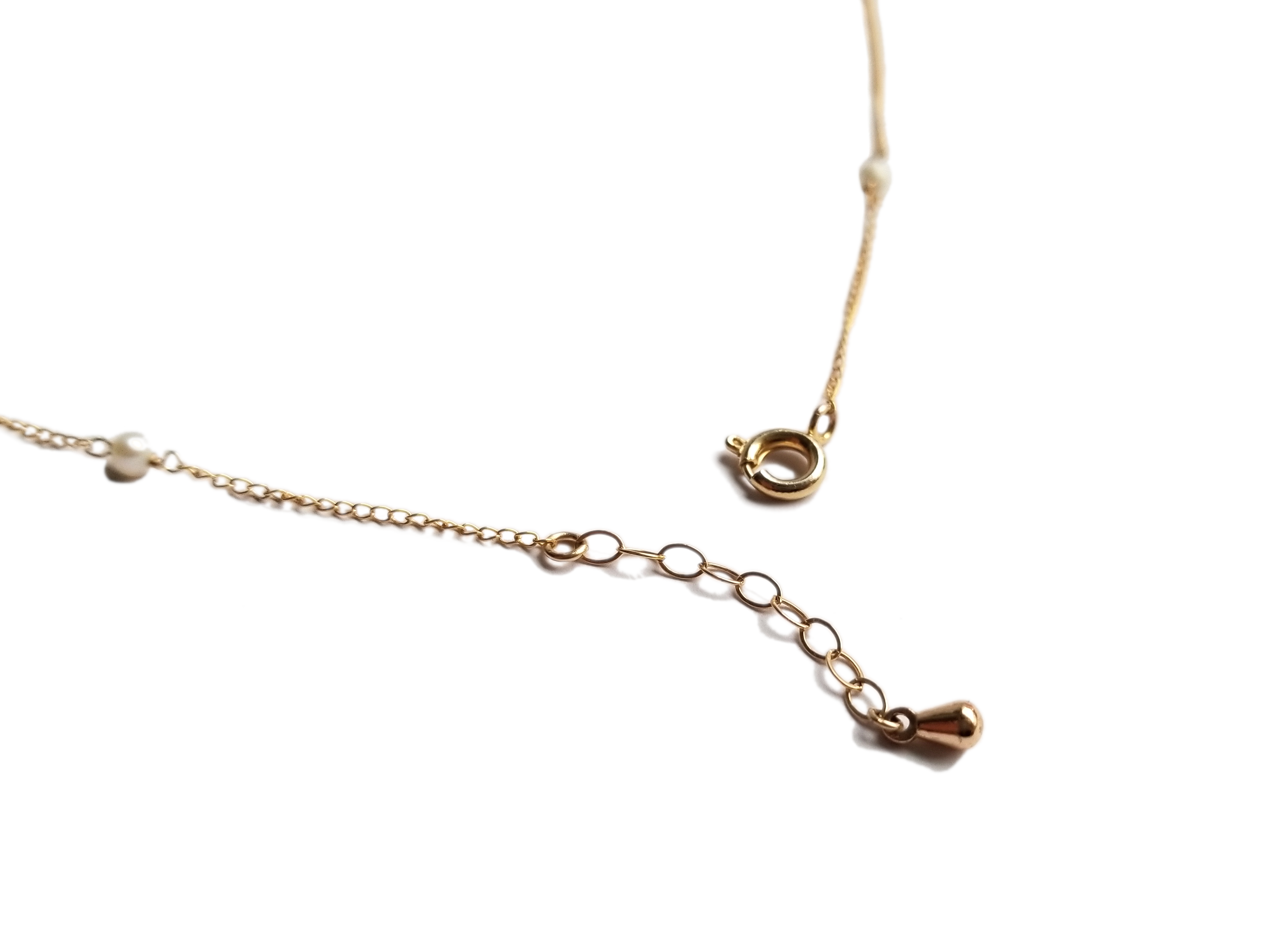 A delicate strand of tiny Freshwater Pearls on a 14KT Gold-filled chain, showcasing its versatility as an anklet, bracelet, or necklace.