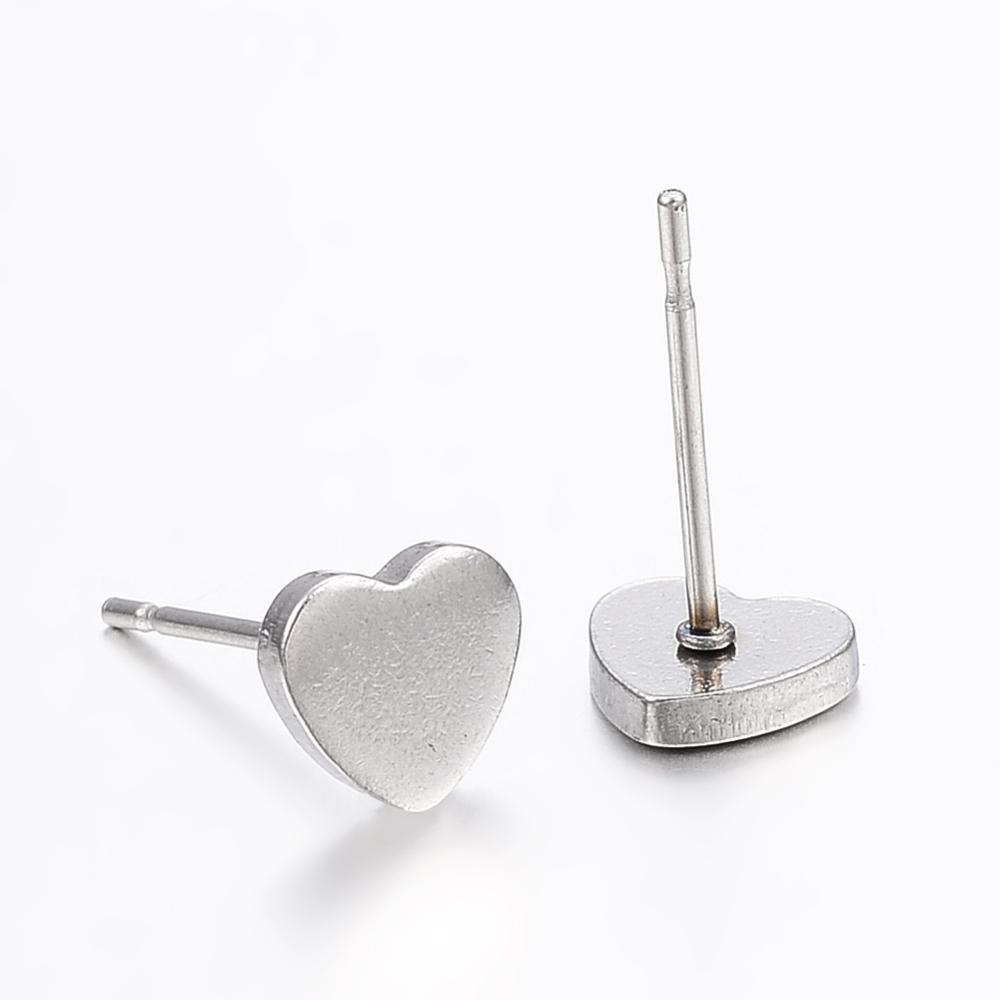 A pair of elegant Silver Heart Stud Earrings made from hypoallergenic 304 stainless steel, beautifully presented on a gift card.