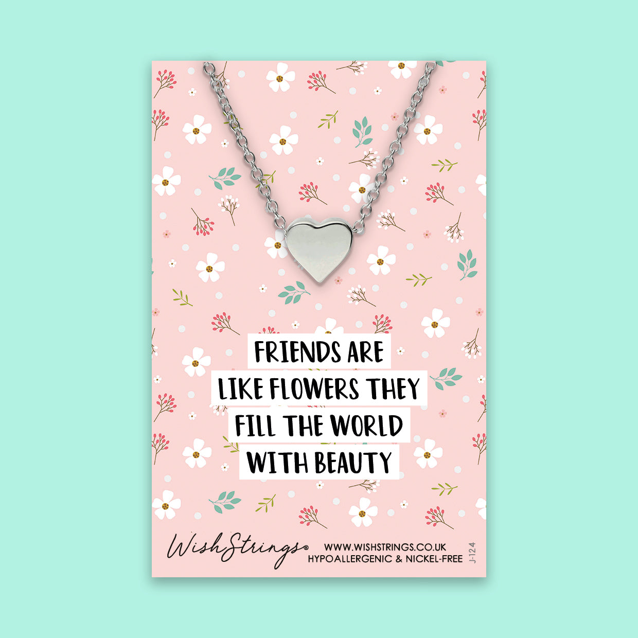 A beautiful heart-shaped necklace with floral design, symbolizing friendship, presented on a gift card.