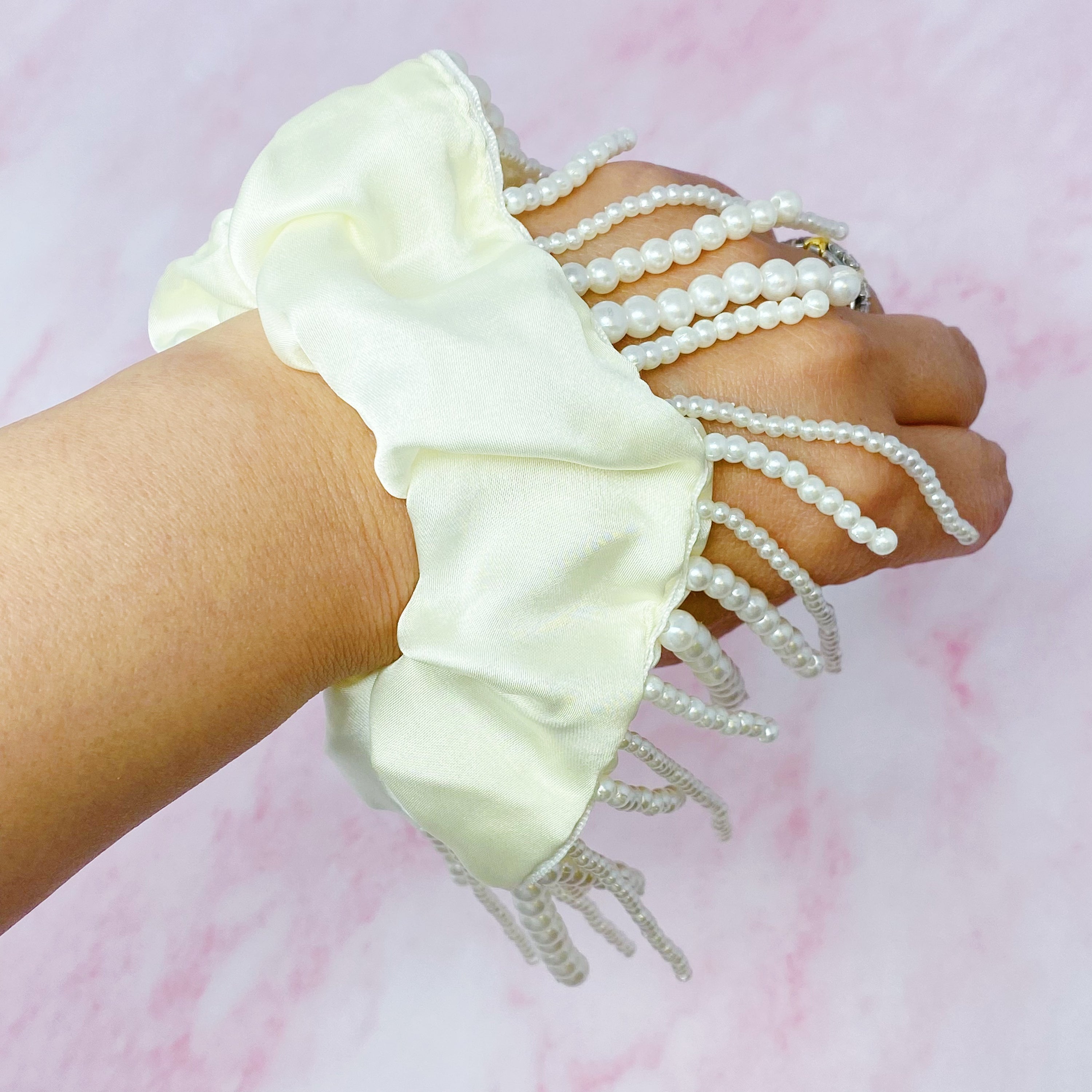 Fringed By Hand Hair Scrunch featuring pearl and bead details in elegant satin material.