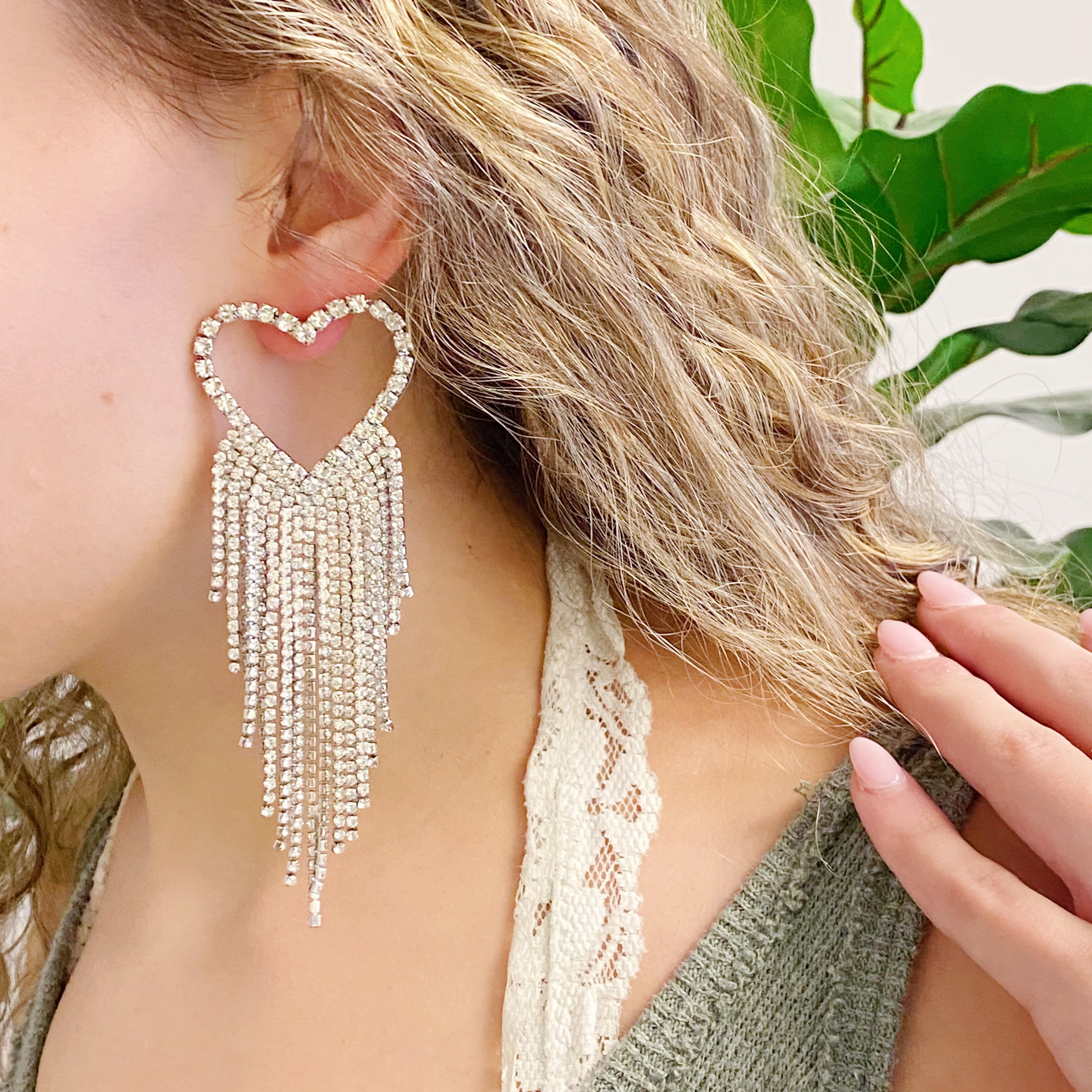 Fringed Shine Heart Earrings with cascading shiny fringes and glass diamond bead accents, showcasing a stylish heart design.