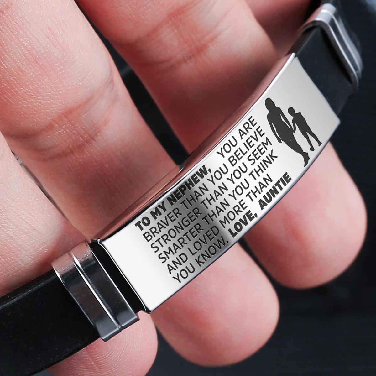 Auntie to Nephew engraved steel and silicone bracelet in silver and gold colors, showcasing a heartfelt message.