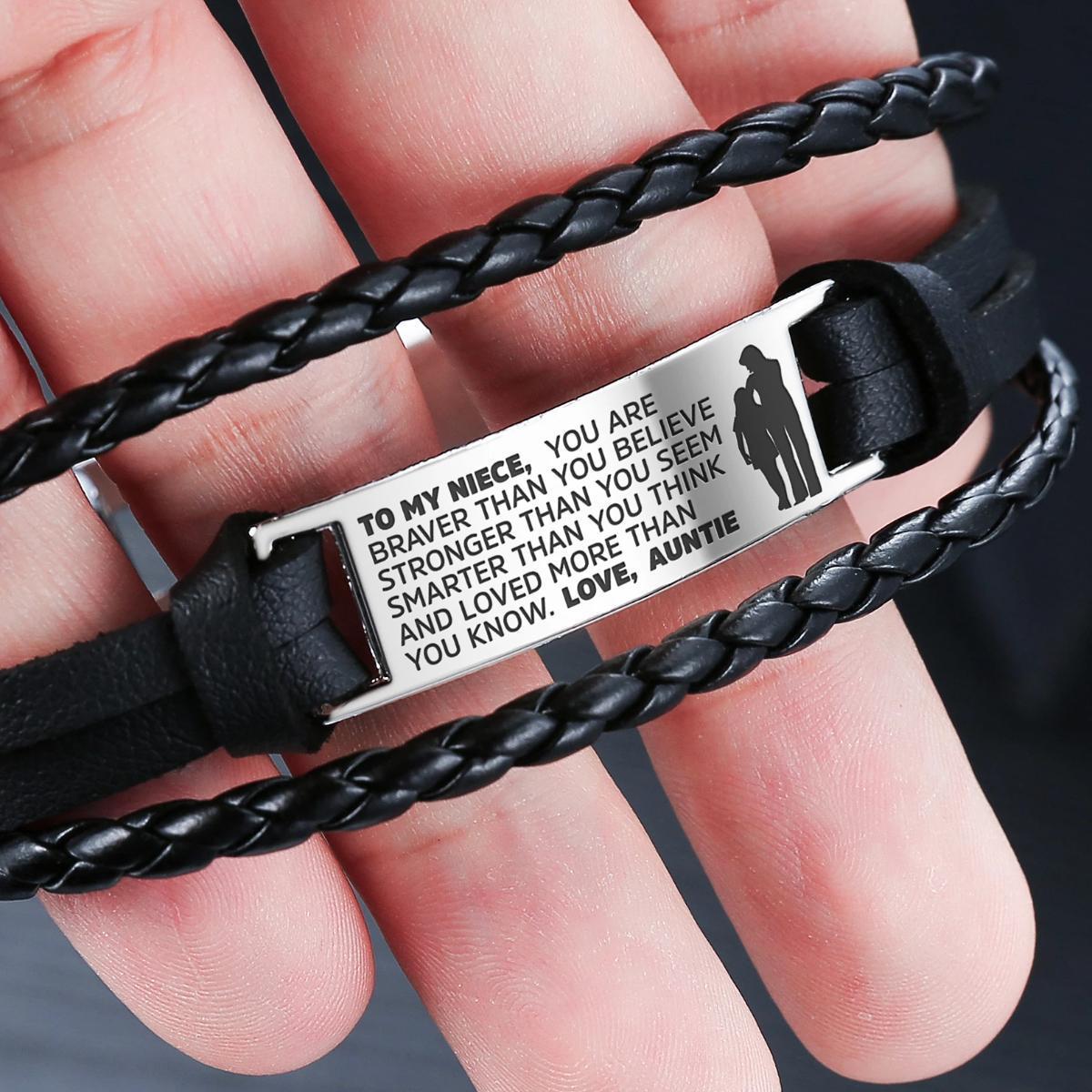 A stylish steel and leather bracelet engraved with a heartfelt message for a niece, featuring a high-strength clasp and elegant design.