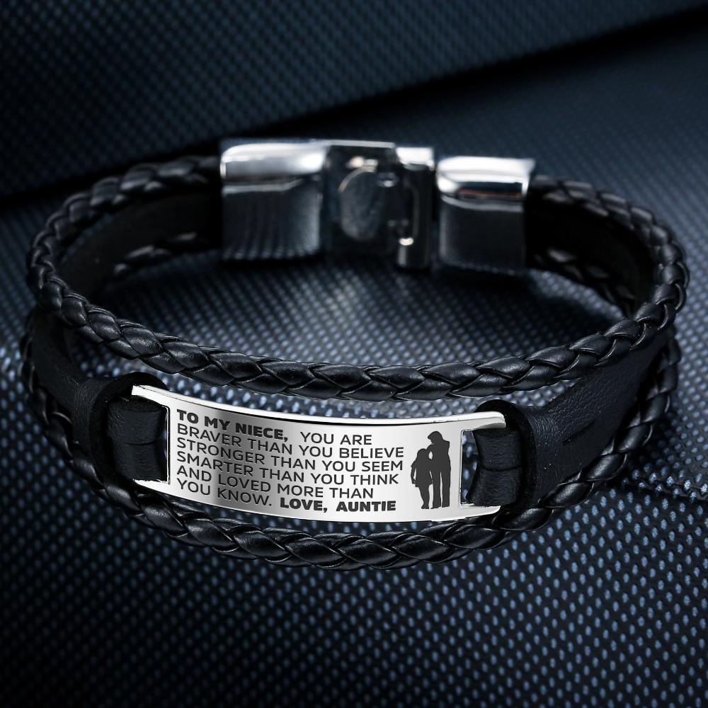 A stylish steel and leather bracelet engraved with a heartfelt message for a niece, featuring a high-strength clasp and elegant design.