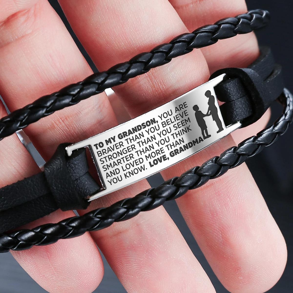 A stylish steel and leather bracelet engraved with a heartfelt message for grandsons, featuring a safety clasp and luxury gift bag.