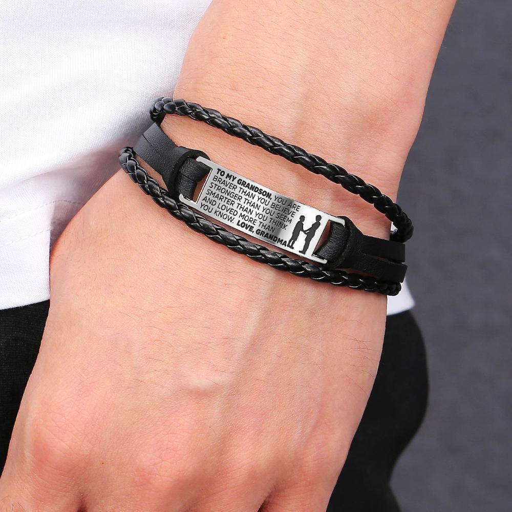 A stylish steel and leather bracelet engraved with a heartfelt message for grandsons, featuring a safety clasp and luxury gift bag.