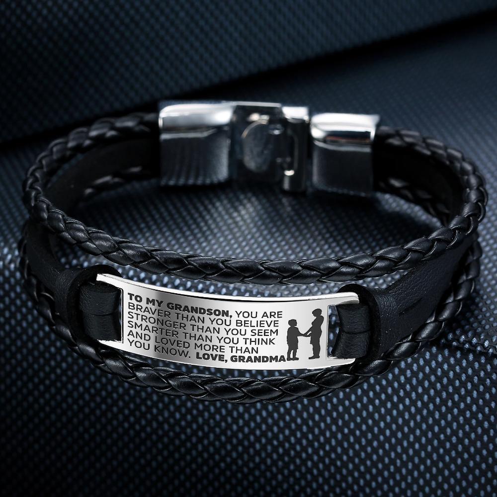 A stylish steel and leather bracelet engraved with a heartfelt message for grandsons, featuring a safety clasp and luxury gift bag.