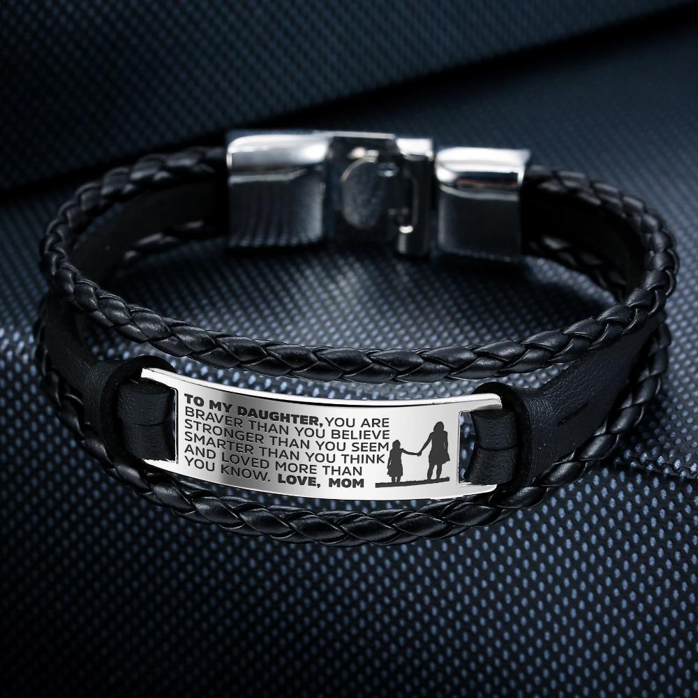 A stylish steel and leather bracelet engraved with a heartfelt message for daughters, showcasing its elegant design and premium materials.