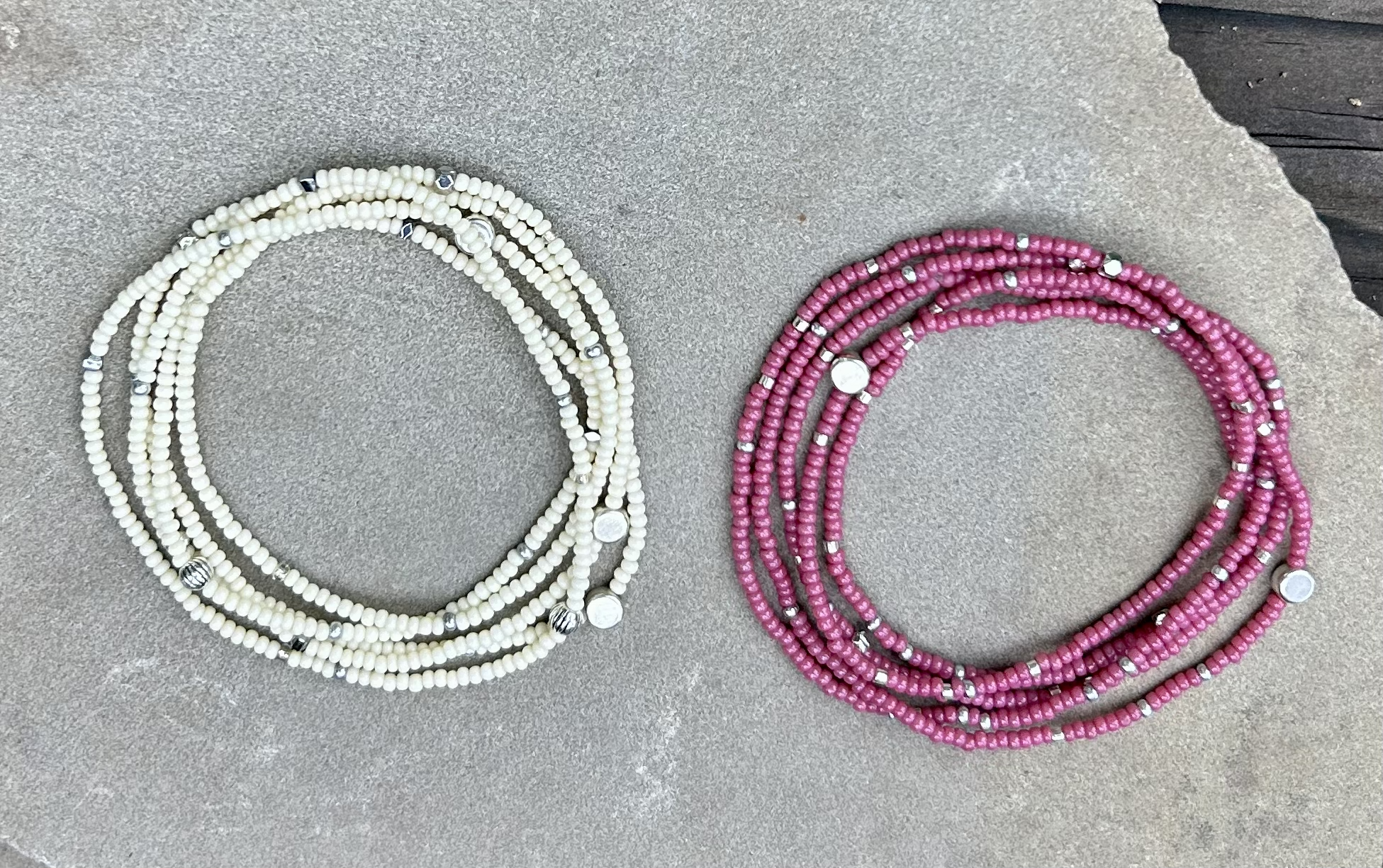 Fuchsia beaded 5-wrap bracelet with silver sprinkles on elastic cording, showcasing vibrant colors and intricate design.