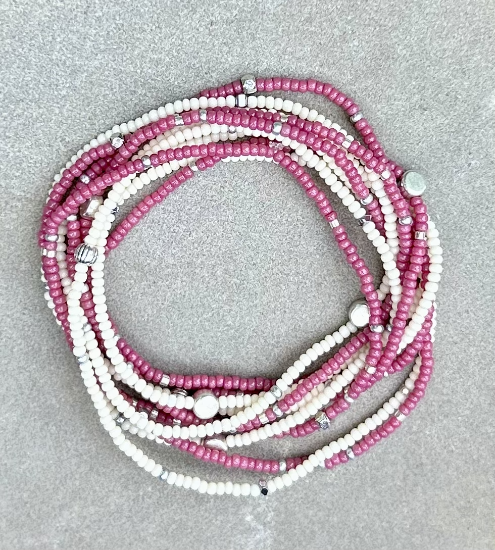 Fuchsia beaded 5-wrap bracelet with silver sprinkles on elastic cording, showcasing vibrant colors and intricate design.