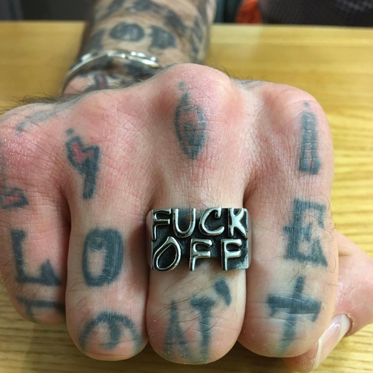 FUCK OFF Stainless Steel Ring showcasing its bold design and shiny finish, perfect for making a statement.