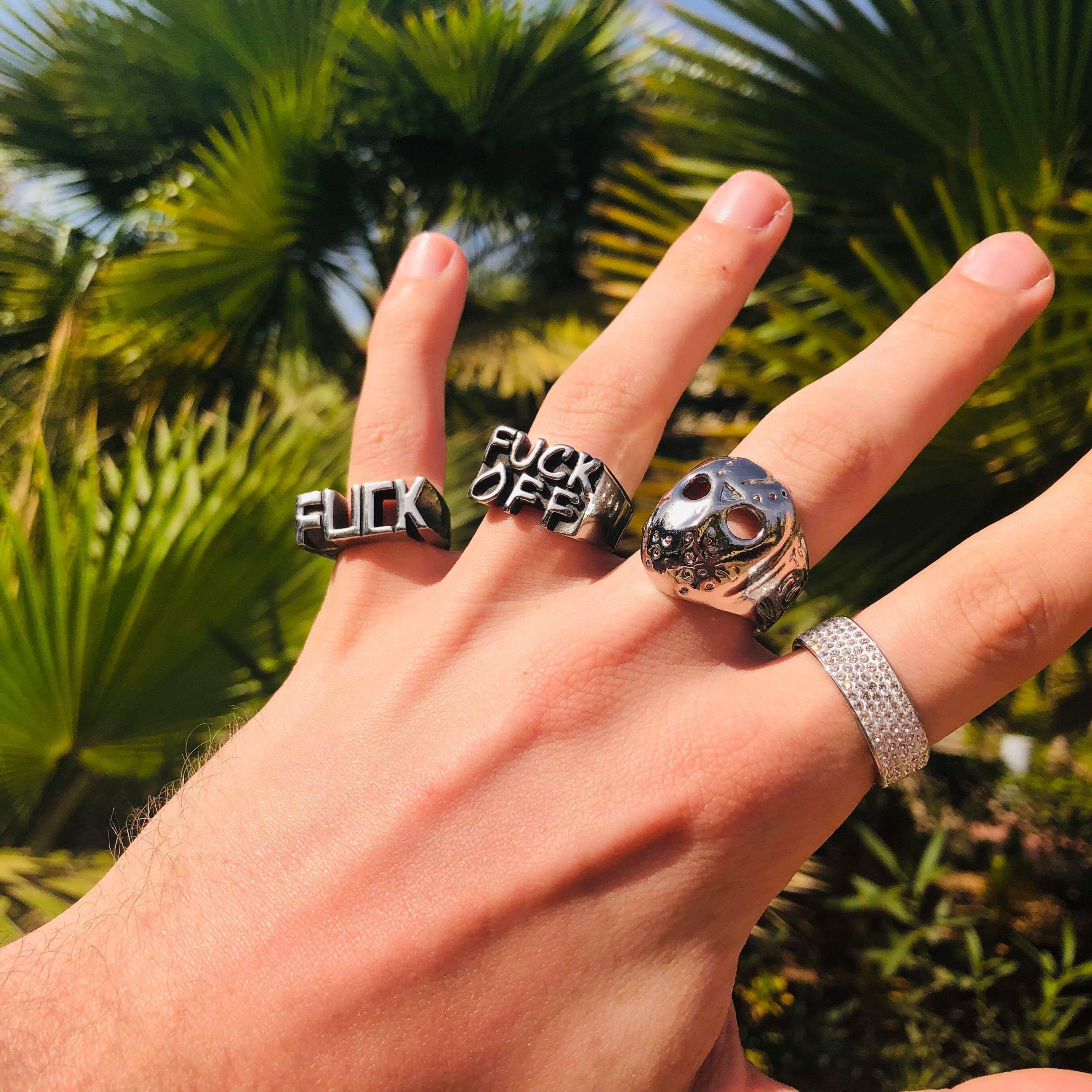 FUCK Stainless Steel Ring showcasing its bold design and shiny finish, available in various sizes and colors.