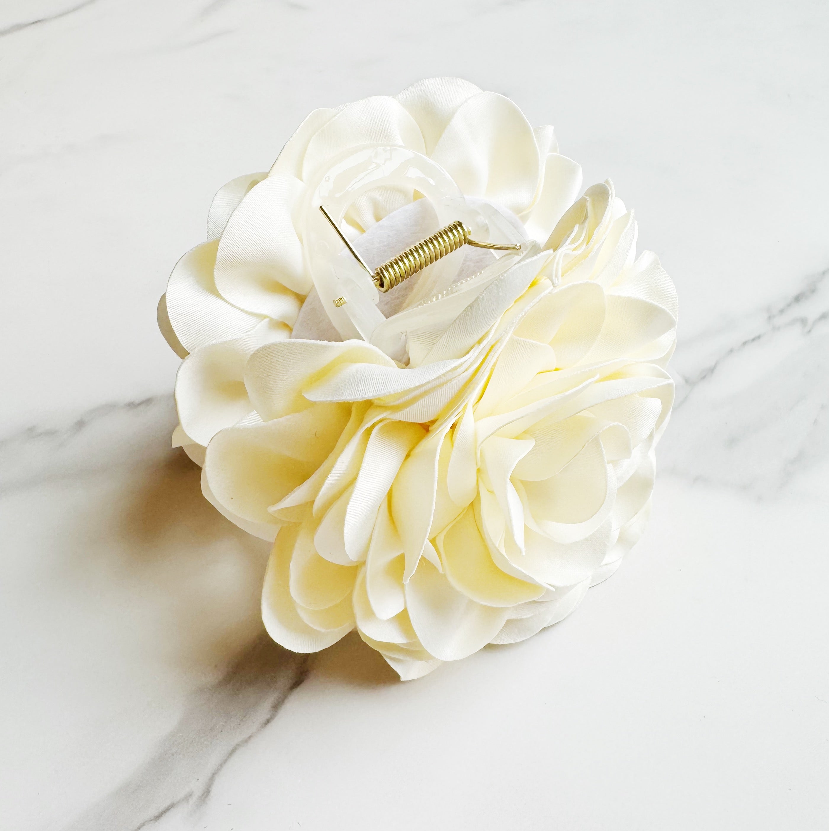 Full Bloom Double Sided Hair Claw featuring a delicate flower design, perfect for elegant hairstyles.