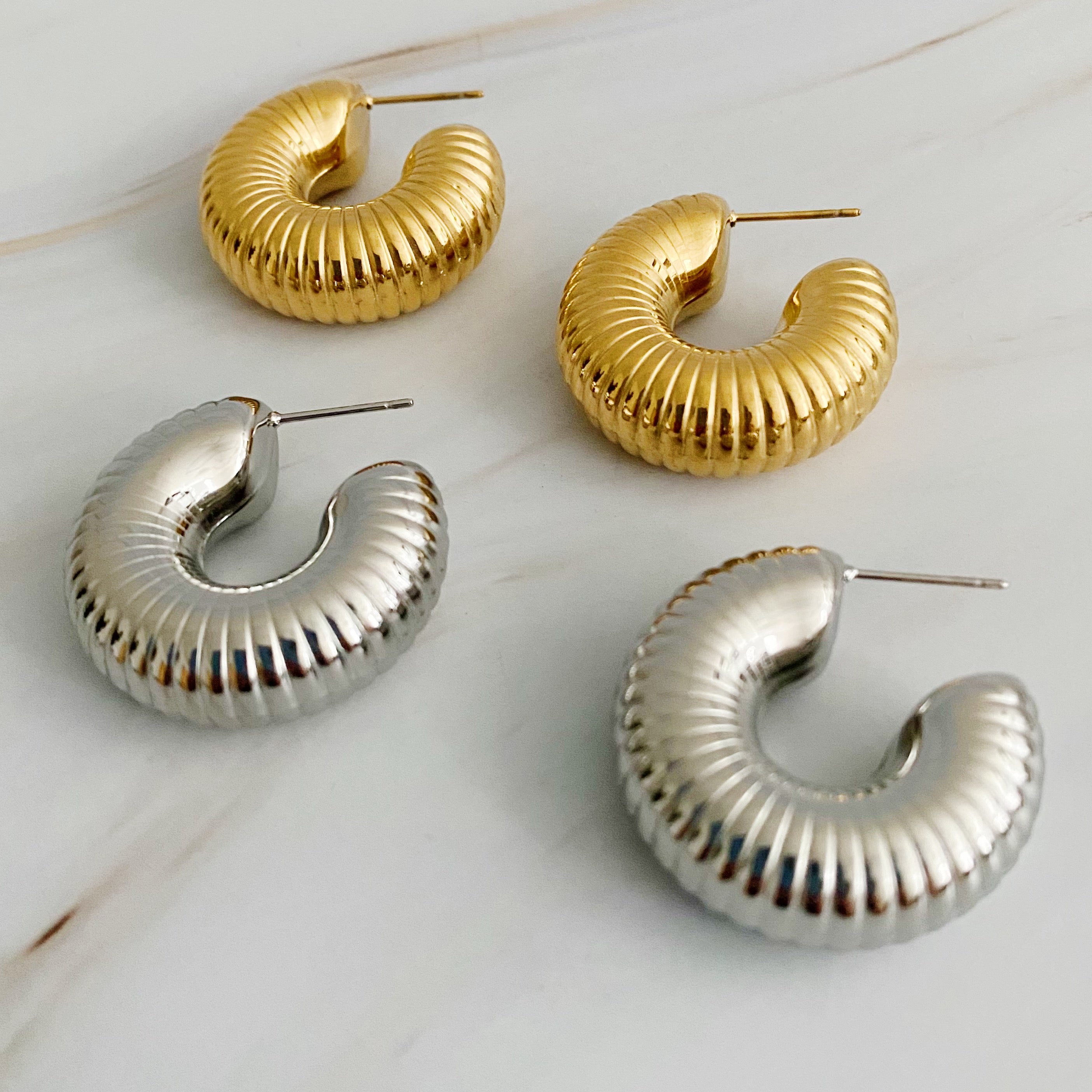 Elegant Full Body In Pleats Hoop Earrings with shiny textured finish, crafted from 18k gold plated stainless steel.