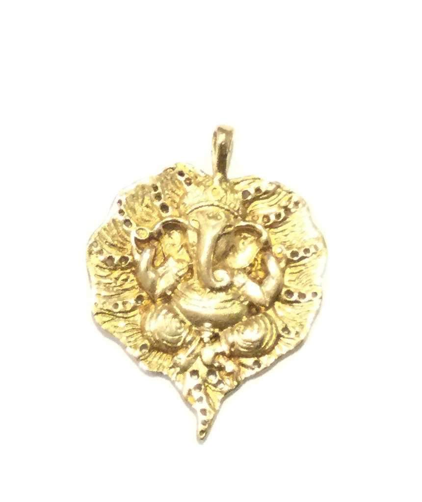 Intricate handmade Ganesha pendant engraved on a leaf, showcasing detailed craftsmanship in brass and silver plating.