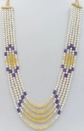 Multi-strand beaded pearl necklace.