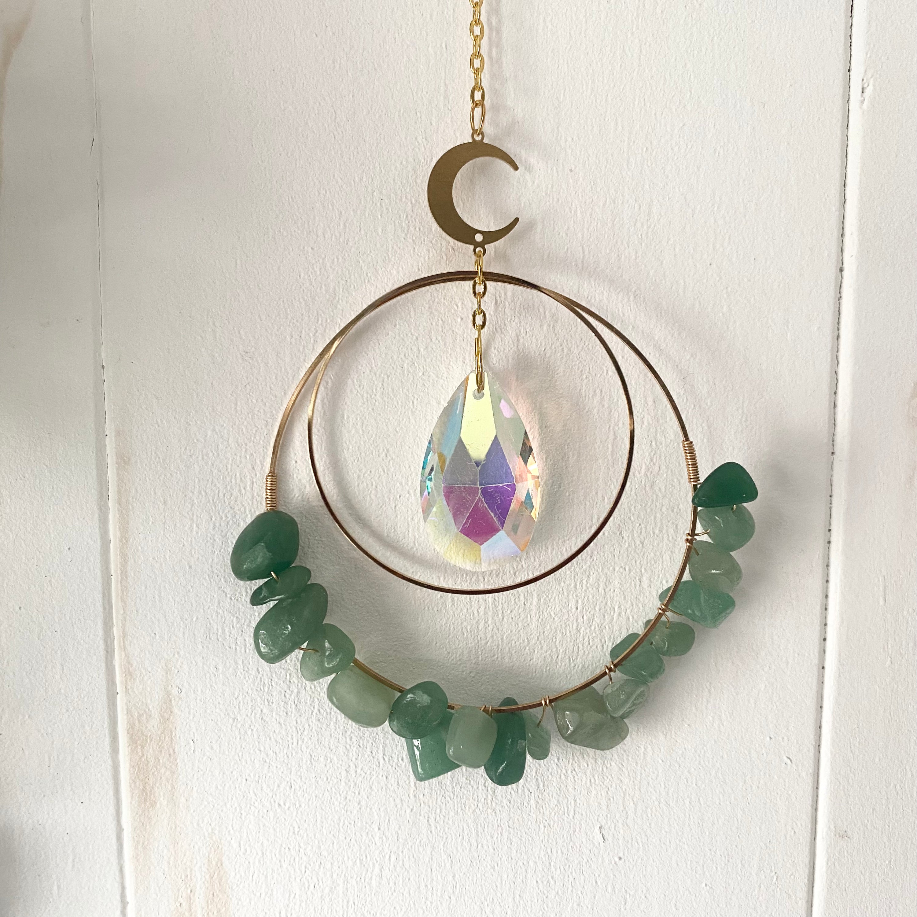 Colorful Gemstone Chip Sun Catchers hanging in sunlight, showcasing vibrant reflections.