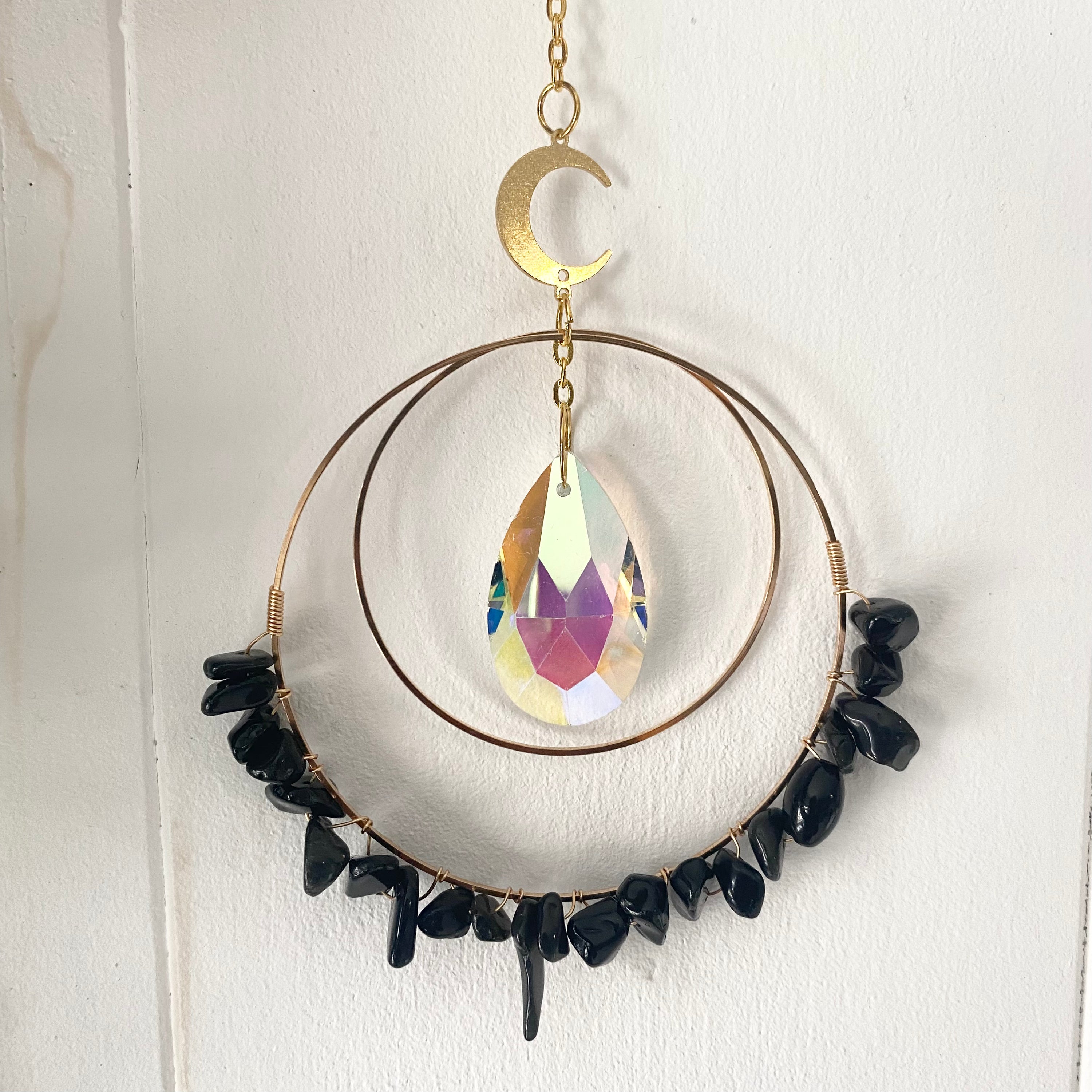 Colorful Gemstone Chip Sun Catchers hanging in sunlight, showcasing vibrant reflections.