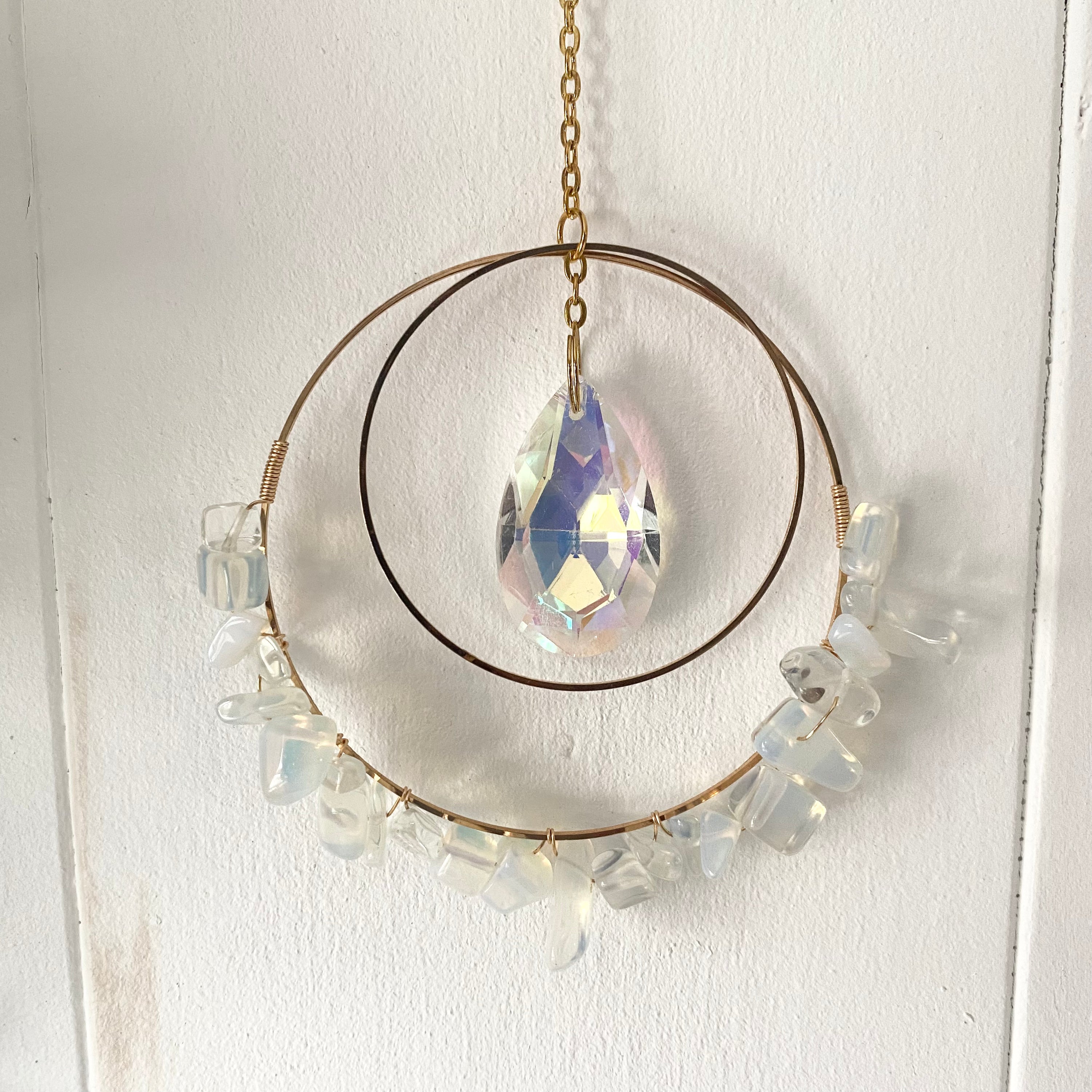 Colorful Gemstone Chip Sun Catchers hanging in sunlight, showcasing vibrant reflections.