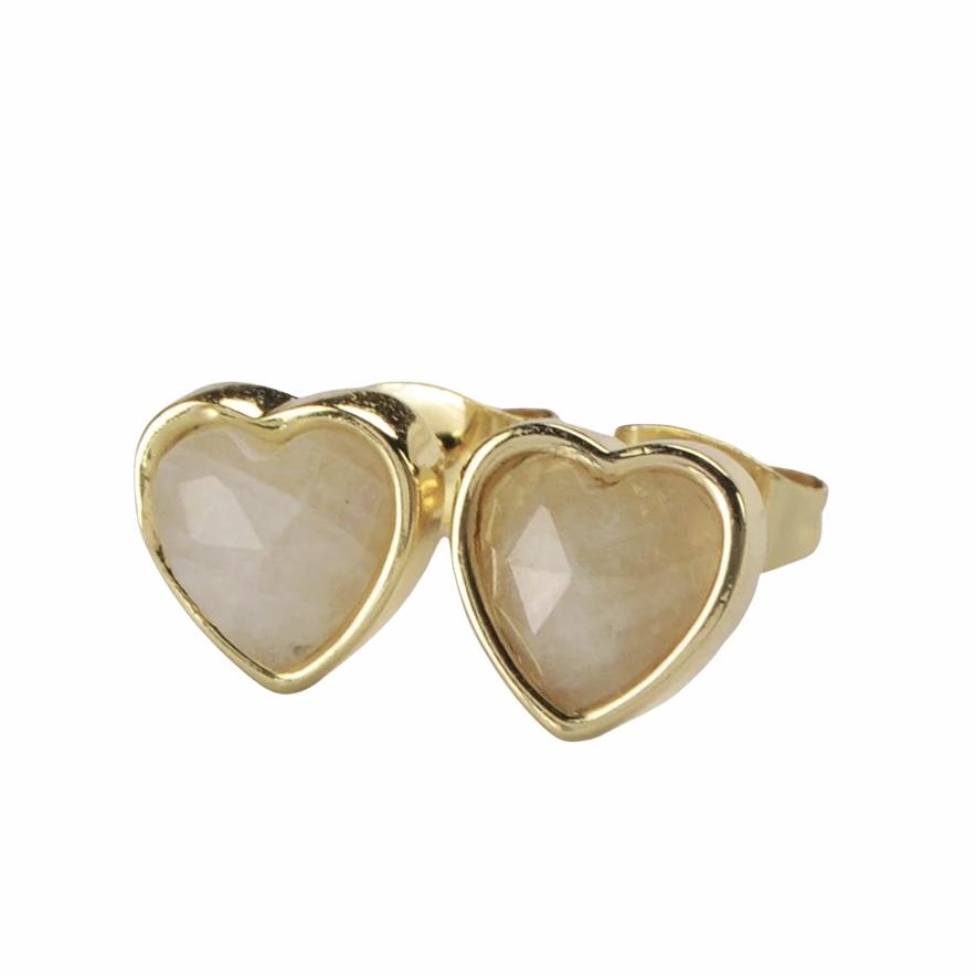 A pair of heart-shaped gemstone studs in amethyst, moonstone, and rose quartz, set in brass with 18K gold plating.