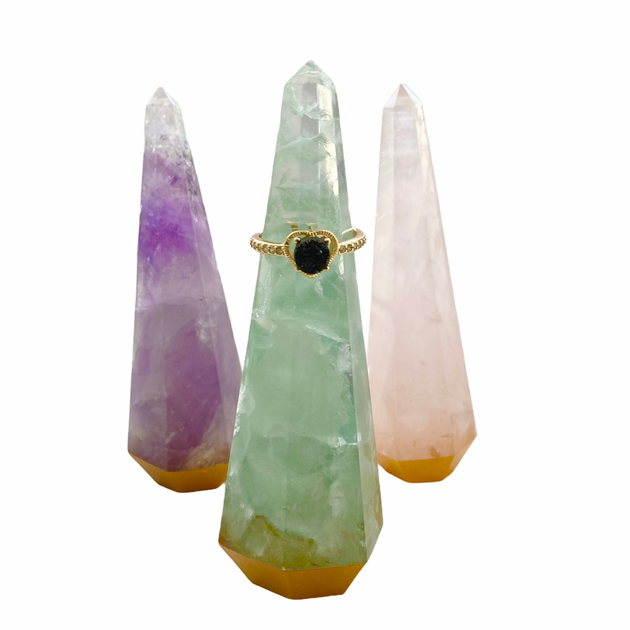 A beautifully handcrafted gemstone ring tower made from natural amethyst, rose quartz, and fluorite, standing 4 inches tall.