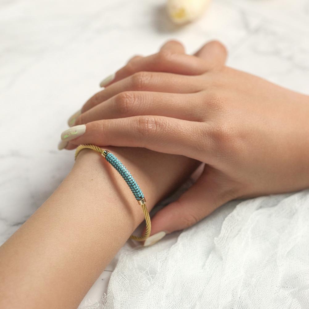 A stylish Gemstone Turquoise Bangle made from surgical stainless steel with 14K gold plating, featuring a vibrant turquoise gemstone.