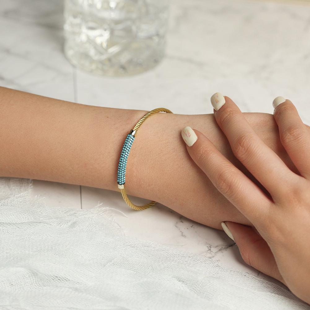 A stylish Gemstone Turquoise Bangle made from surgical stainless steel with 14K gold plating, featuring a vibrant turquoise gemstone.