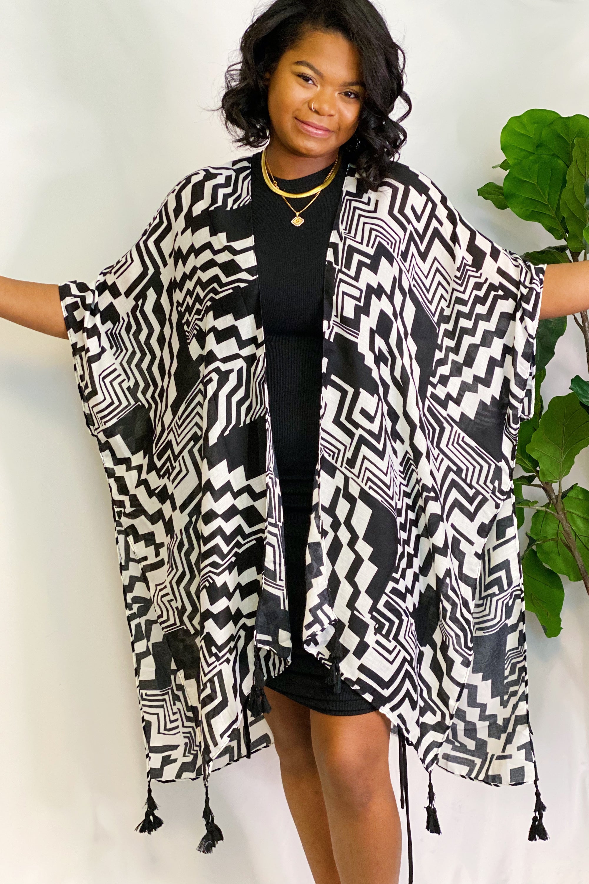 A stylish Geometric Art Kimono featuring an abstract print, lightweight and flowy, perfect for layering over outfits.