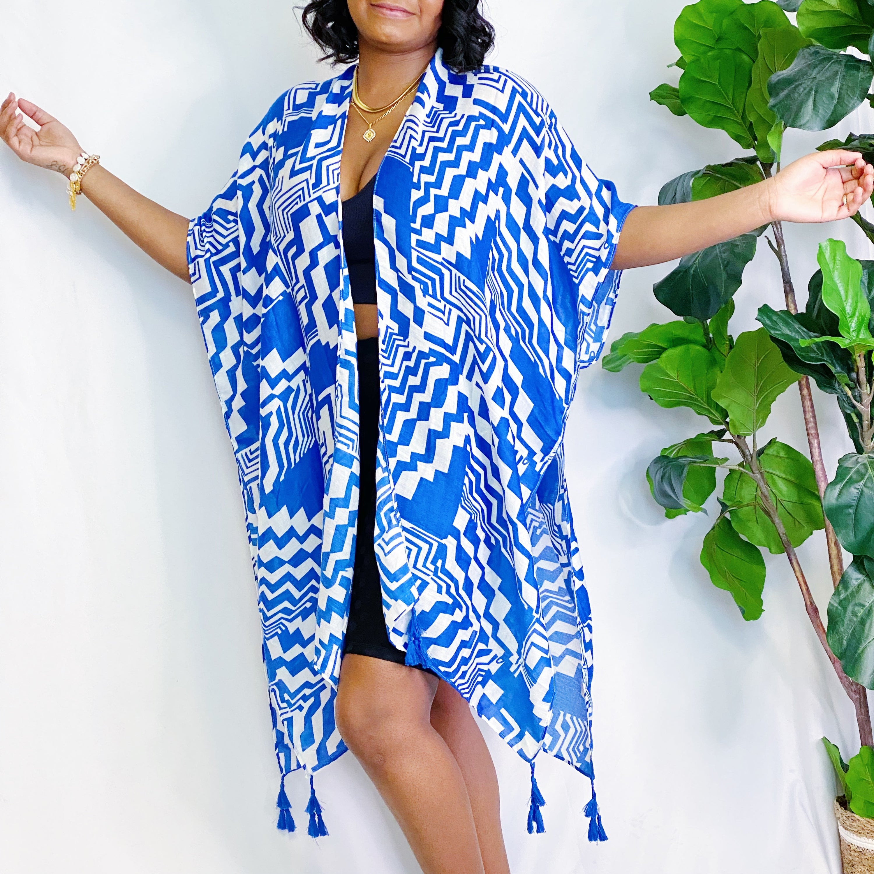 A stylish Geometric Art Kimono featuring an abstract print, lightweight and flowy, perfect for layering over outfits.