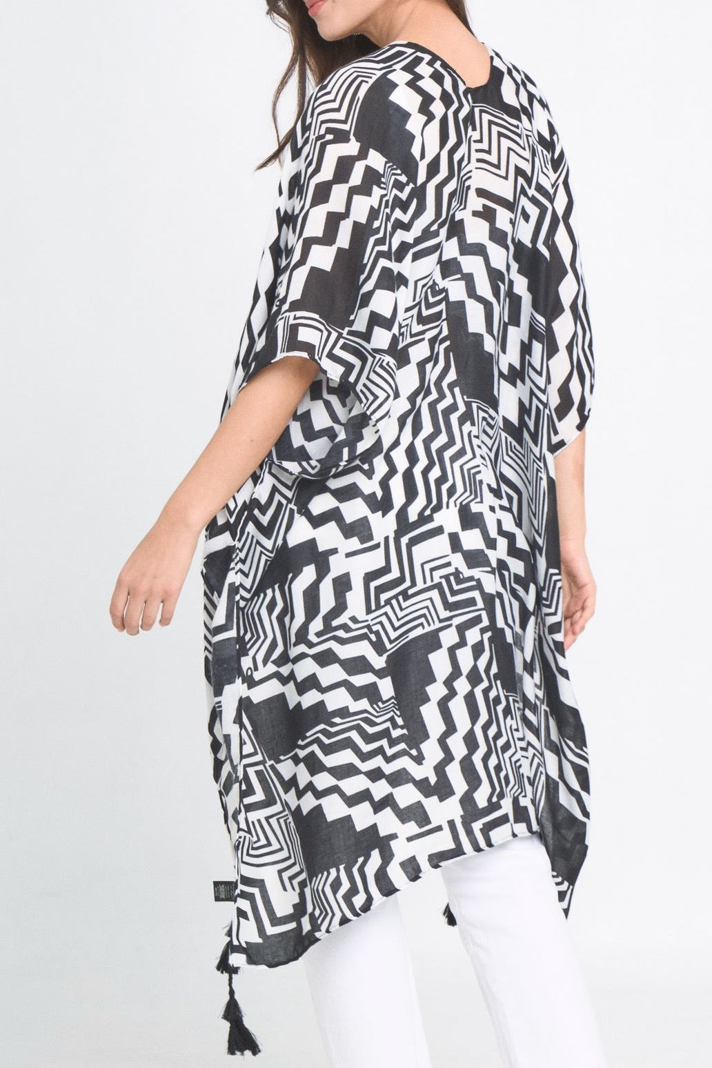 A stylish Geometric Art Kimono featuring an abstract print, lightweight and flowy, perfect for layering over outfits.