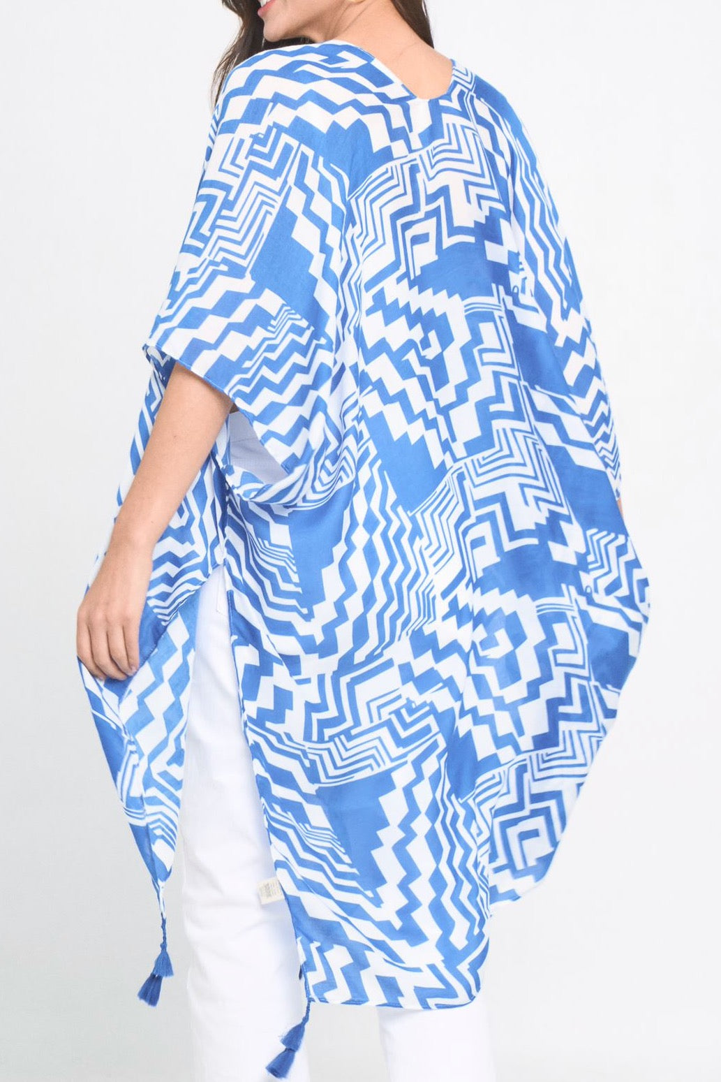 A stylish Geometric Art Kimono featuring an abstract print, lightweight and flowy, perfect for layering over outfits.