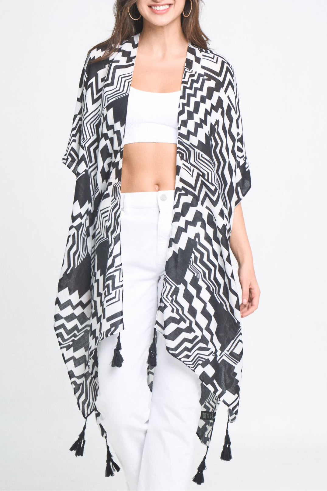 A stylish Geometric Art Kimono featuring an abstract print, lightweight and flowy, perfect for layering over outfits.