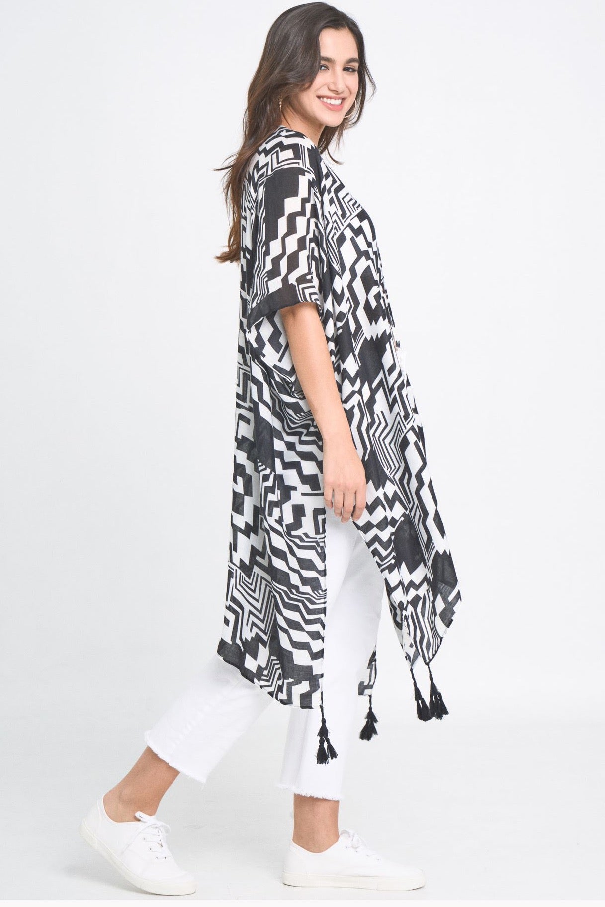 A stylish Geometric Art Kimono featuring an abstract print, lightweight and flowy, perfect for layering over outfits.