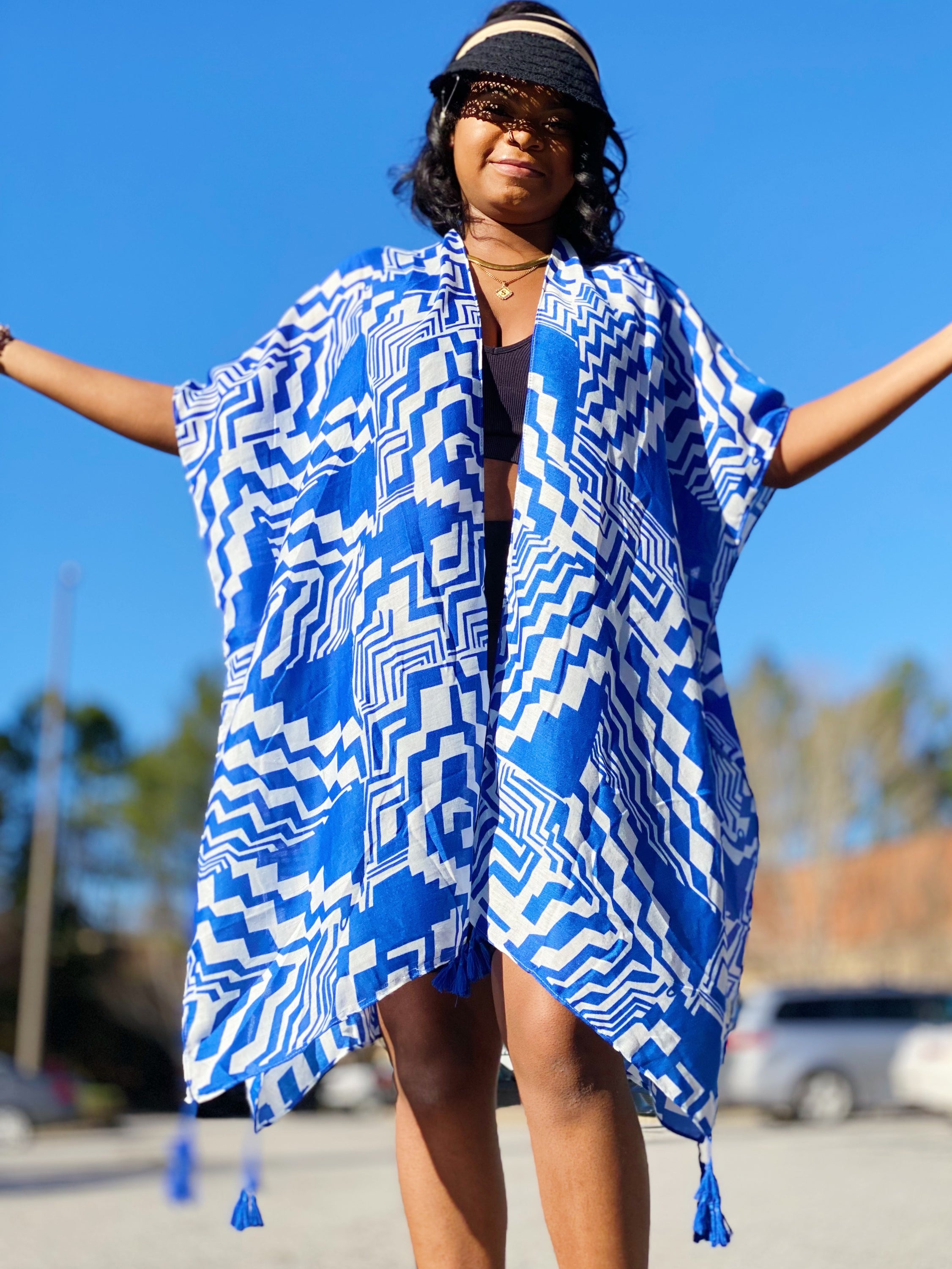 A stylish Geometric Art Kimono featuring an abstract print, lightweight and flowy, perfect for layering over outfits.