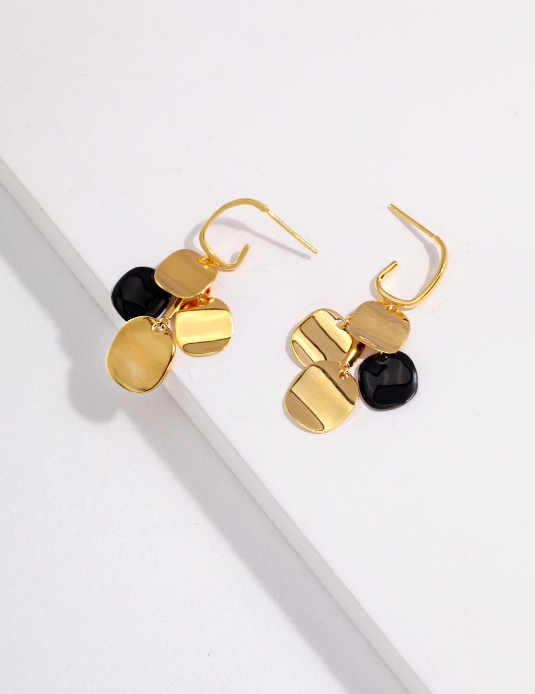 A pair of Geometric Glitter Stack Earrings made from sterling silver and gold vermeil, showcasing a modern design with a glittery finish.