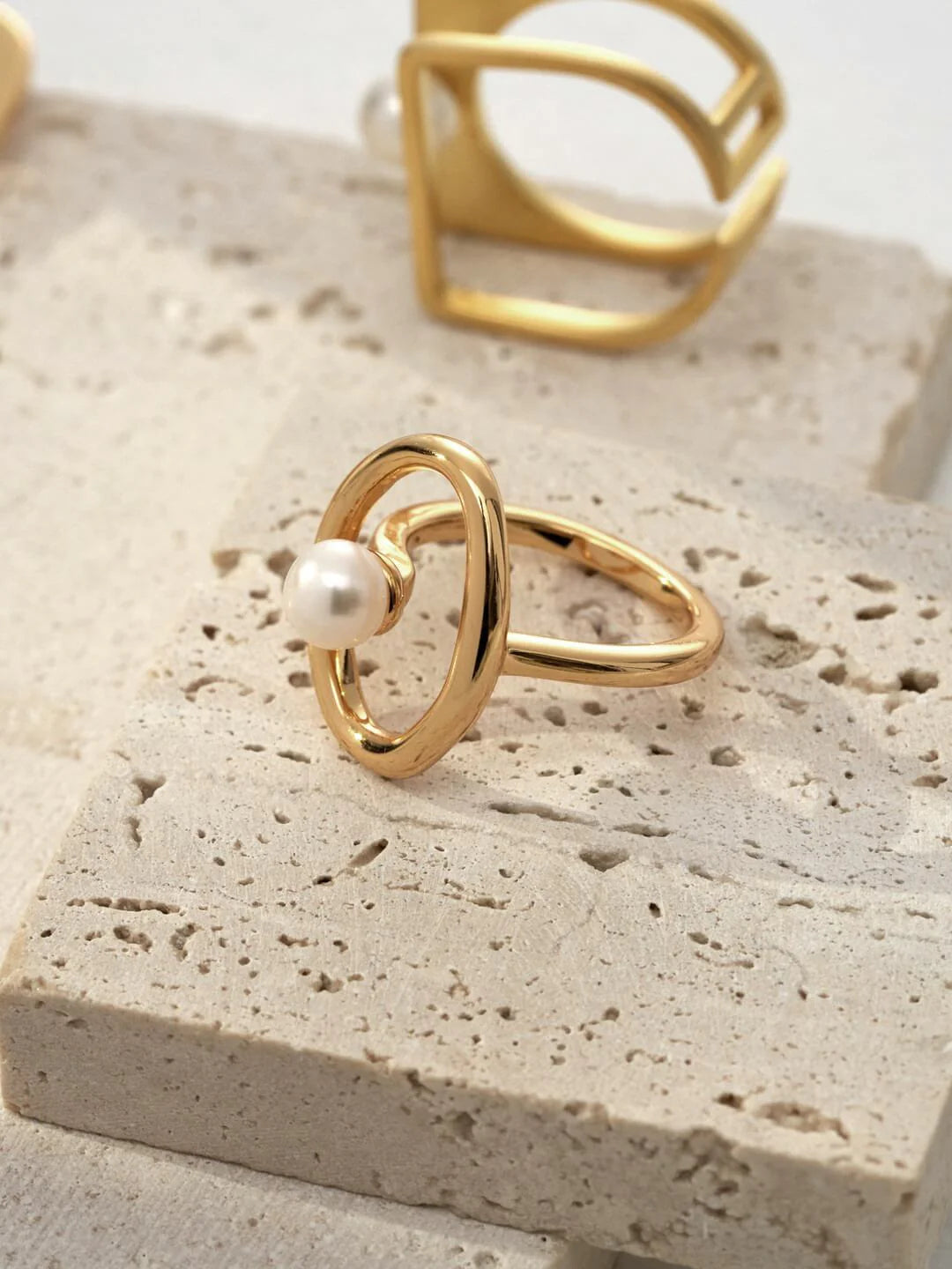 A beautifully handcrafted Geometric Open Circle Ring featuring natural pearls and sterling silver with gold vermeil plating.