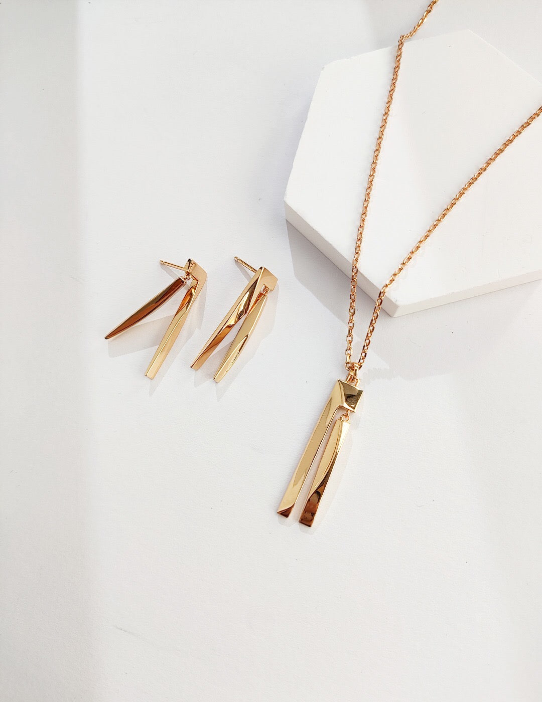 Elegant Geometric Sculpture Bar Earrings made of sterling silver and gold vermeil, showcasing a modern design.