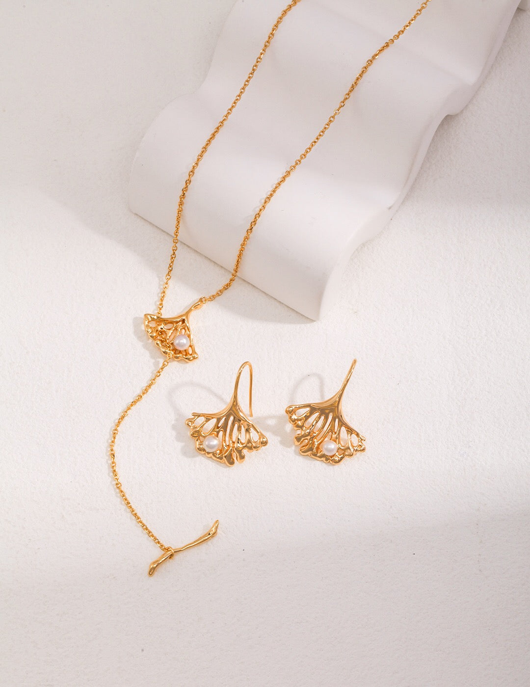 Elegant Ginkgo Leaf Pearl Earrings featuring natural pearls and gold vermeil, showcasing a unique leaf design.