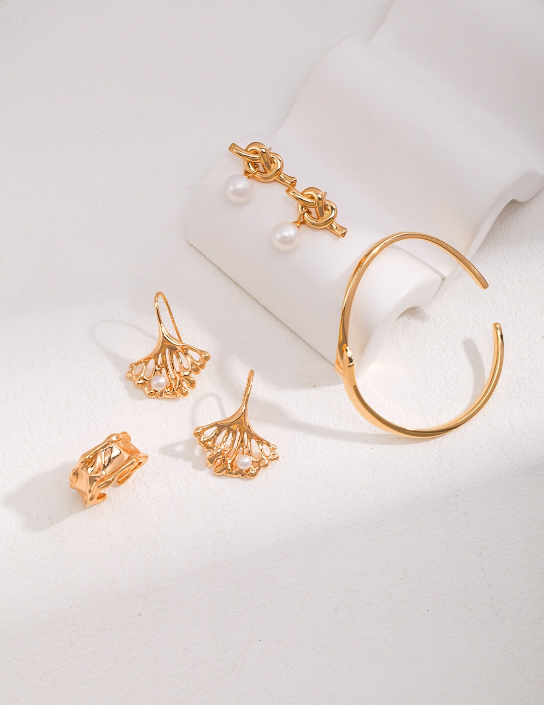 Elegant Ginkgo Leaf Pearl Earrings featuring natural pearls and gold vermeil, showcasing a unique leaf design.