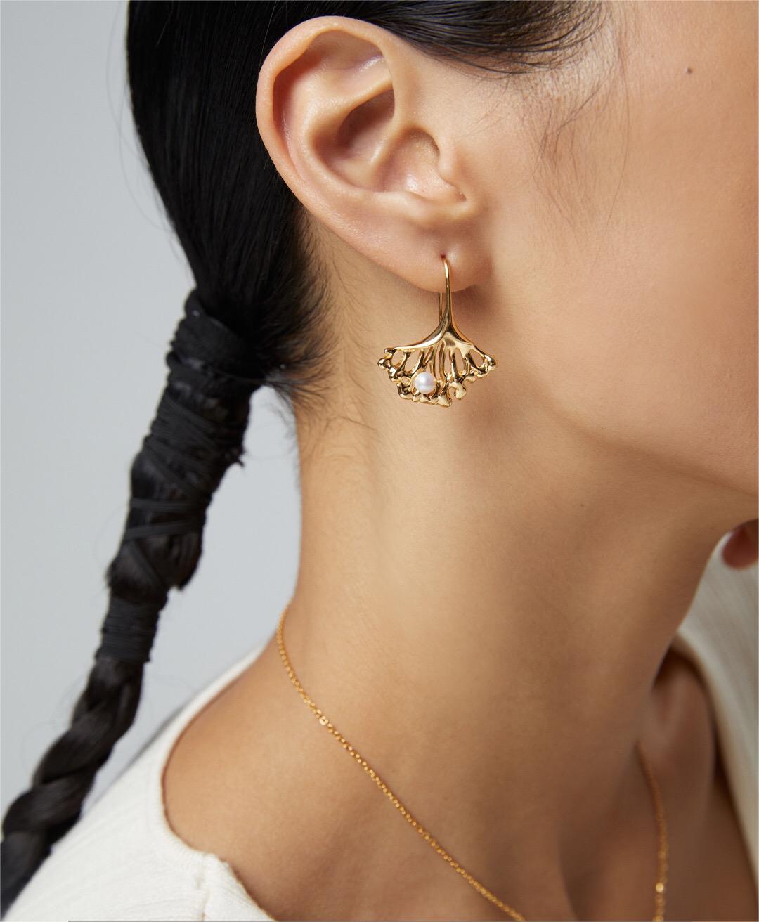 Elegant Ginkgo Leaf Pearl Earrings featuring natural pearls and gold vermeil, showcasing a unique leaf design.