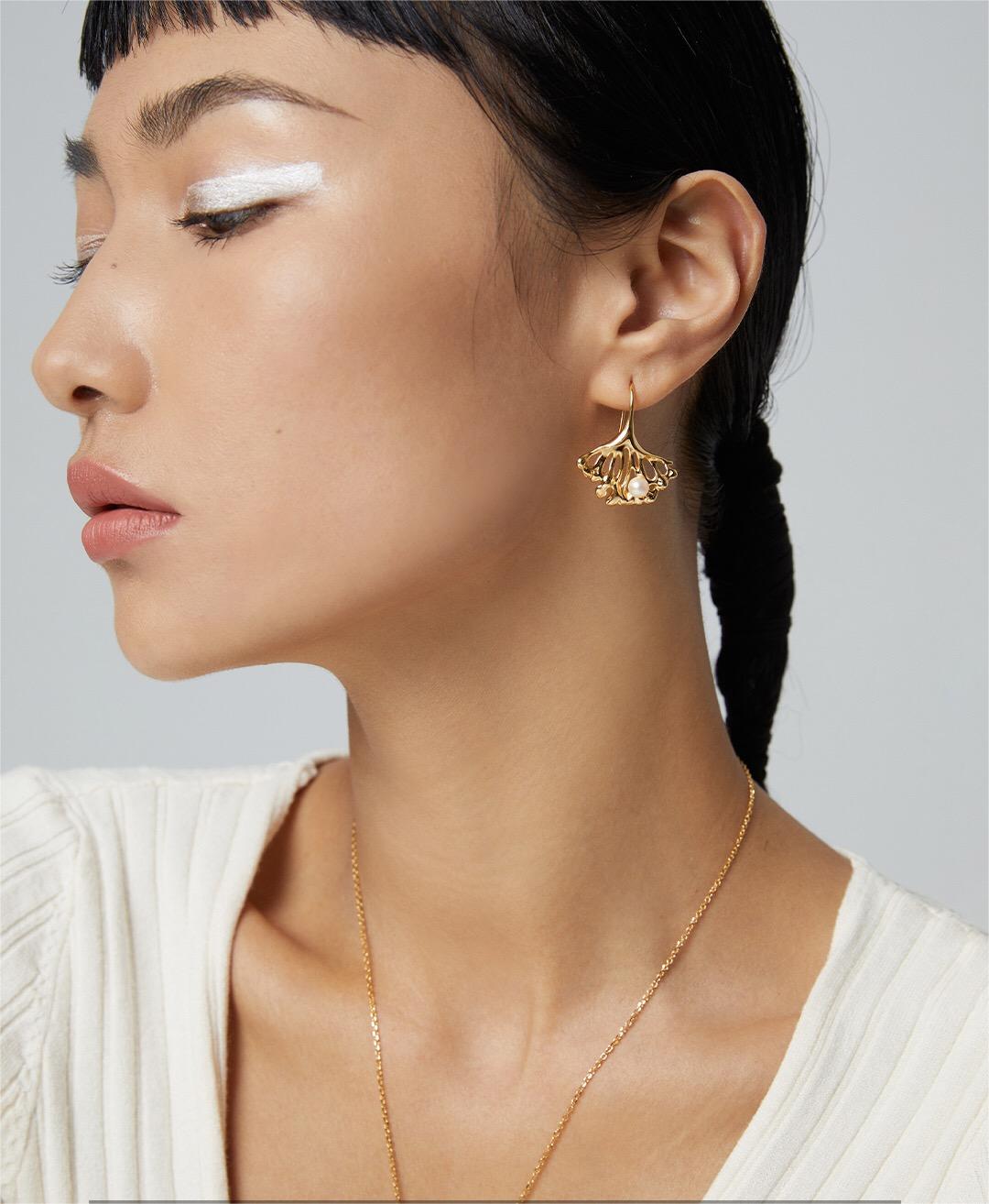 Elegant Ginkgo Leaf Pearl Earrings featuring natural pearls and gold vermeil, showcasing a unique leaf design.