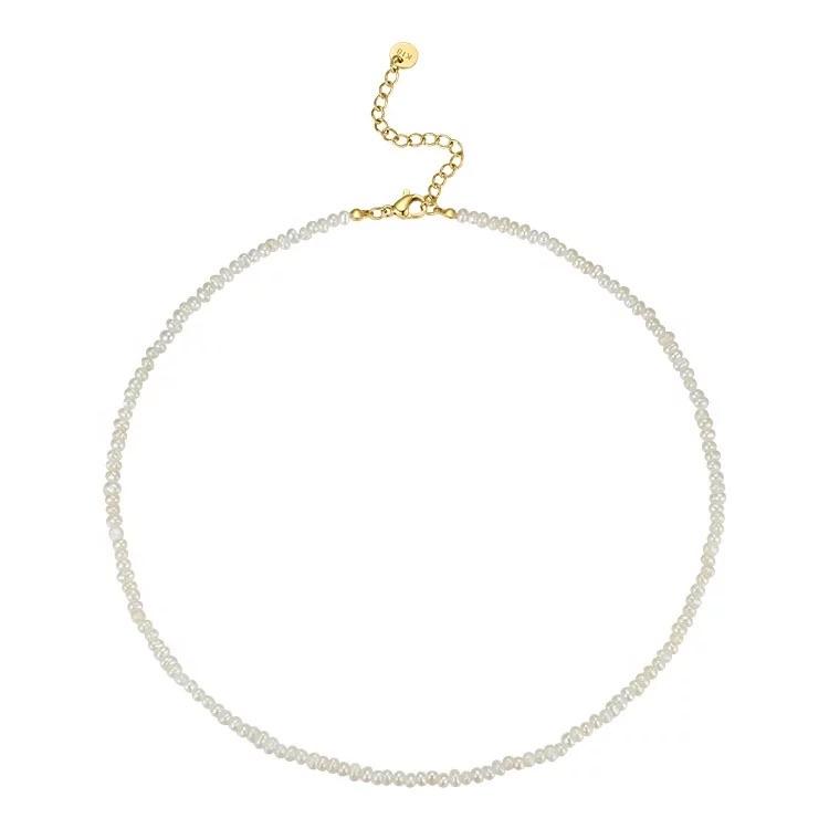 Ginny Pearl Choker featuring elegant pearls on a delicate chain, adjustable length for a perfect fit.