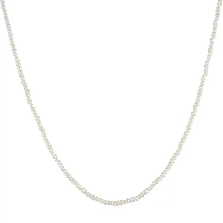 Ginny Pearl Choker featuring elegant pearls on a delicate chain, adjustable length for a perfect fit.