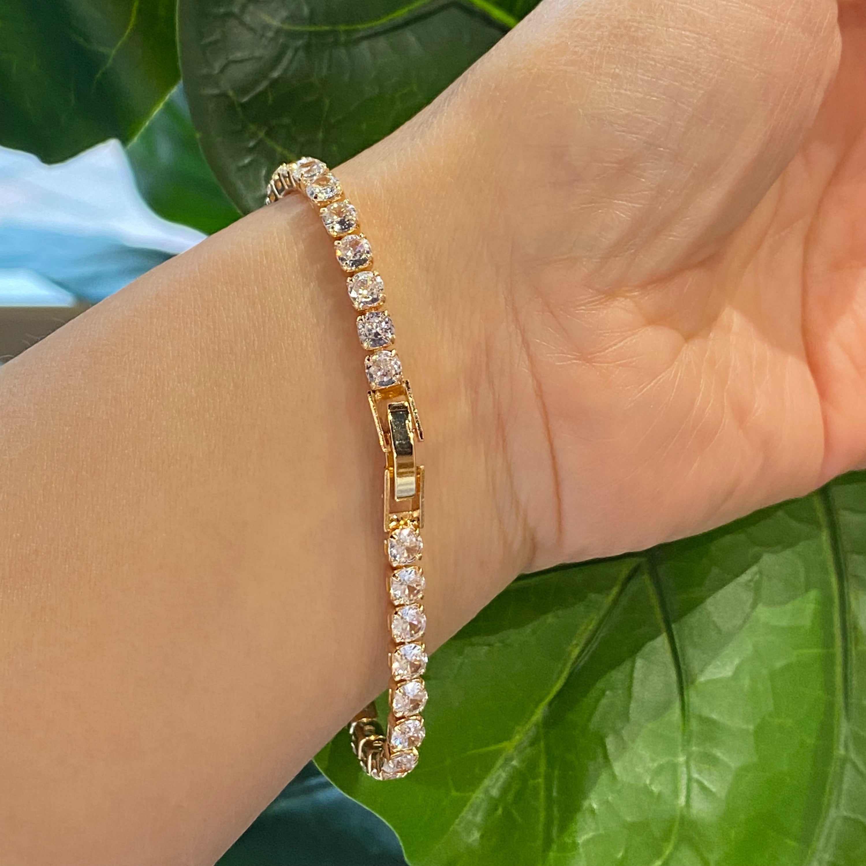 Girls Dream Tennis Bracelet featuring sparkling cubic zirconia stones set in a brass chain with a secure clasp closure.