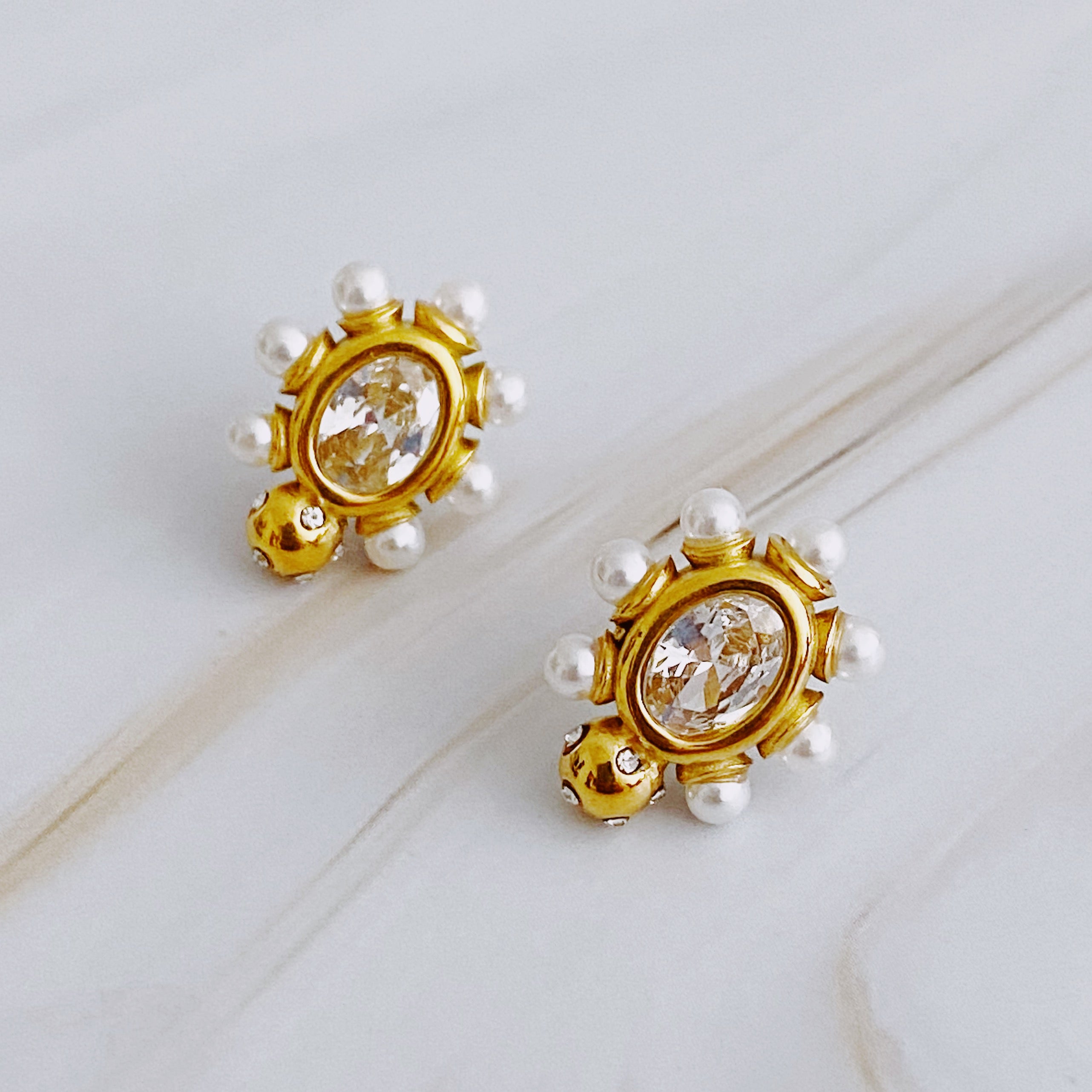 Glam On The Yacht Stud Earrings featuring pearls and sparkly stones in a delicate design, set in 18k gold plated stainless steel.