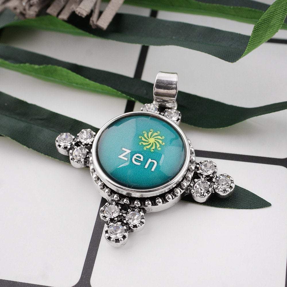 Zen Snap jewelry charm with a glass dome, showcasing intricate design and vibrant colors, perfect for interchangeable snap jewelry.